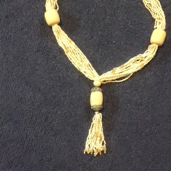 Multi strand tassel necklace w/ ivory like large ornaments - Picture 2 of 3